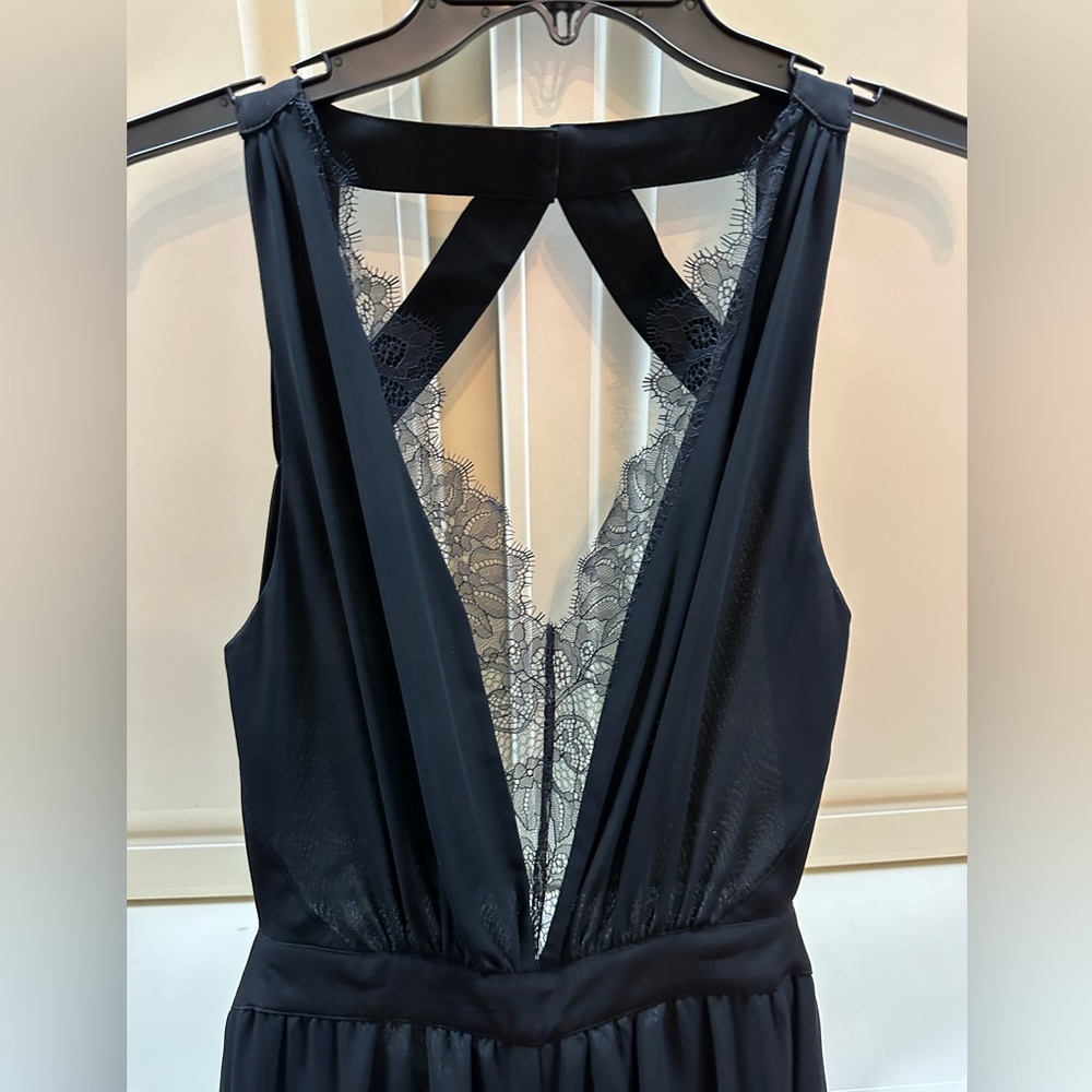 Black, backless BCBG romper, size 2 NEVER WORN w/ tag
